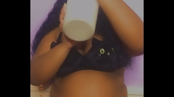 Ebony with an huge belly drinking milk